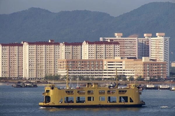Ferry passing housing developments in Penang