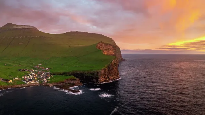 Framed Print : Fiery sky at dawn over the village of Gjogv ovelooking the ocean, aerial view, Eysturoy Island, Faroe Islands, Denmark, Europe Framed Print : Fiery sky at dawn over the village of Gjogv ovelooking the ocean, aerial view, Eysturoy Island, Faroe Islands, Denmark, Europe
