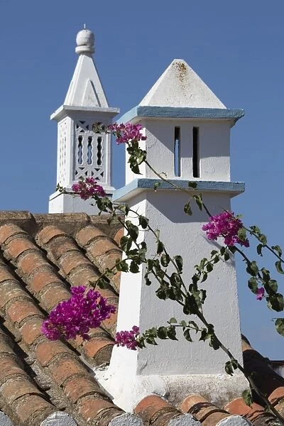Filigreed chimney pots and Bougainvillea, Algarve, Portugal, Europe