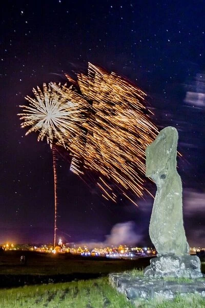 Fireworks ring in the New Year from the town of Hanga Roa over moai in the Tahai Archaeological Zone on Easter Island (Isla de Pascua) (Rapa Nui), UNESCO World Heritage Site, Chile, South America