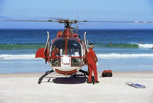 First aid medical helicopter lands on the beach