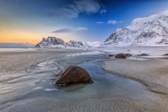 Framed Print : The first light of dawn illuminates the rocks shaped by the wind and the cold sea of Uttakleiv Framed Print : The first light of dawn illuminates the rocks shaped by the wind and the cold sea of Uttakleiv