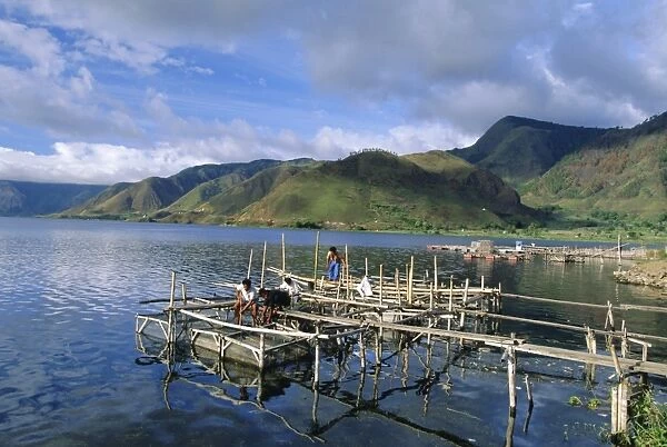 Fish rearing cages on northern tip of Lake Toba