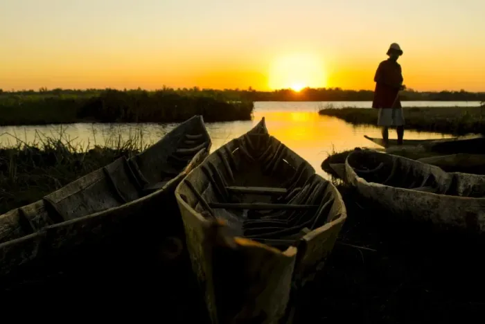 Framed Print : Fisherman repairs his net at sunset, Canal des Pangalanes, Mankara, Madagascar Framed Print : Fisherman repairs his net at sunset, Canal des Pangalanes, Mankara, Madagascar