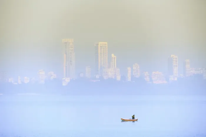 Framed Print : A fisherman in front of the skyscrapers of the Malabar Hills in Mumbai (Bombay), Maharashtra Framed Print : A fisherman in front of the skyscrapers of the Malabar Hills in Mumbai (Bombay), Maharashtra