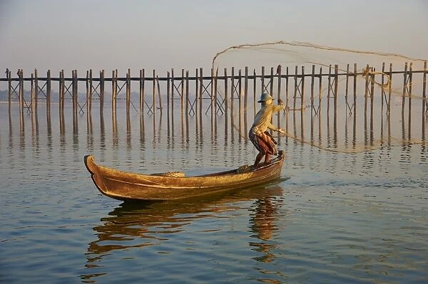 Fisherman on Taung Thama Lake and U Bein bridge at Amarapura, Mandalay Province, Myanmar (Burma), Asia
