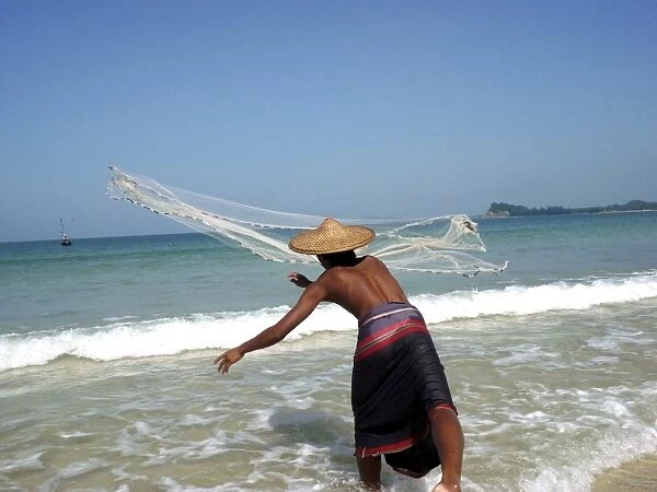 Fisherman throwing his net, Ngapali, Myanmar, Asia