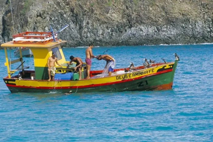 Framed Print : Fishermen on fishing boat, Parque Nacional de Fernando de Norohna, Fernando de Noronha