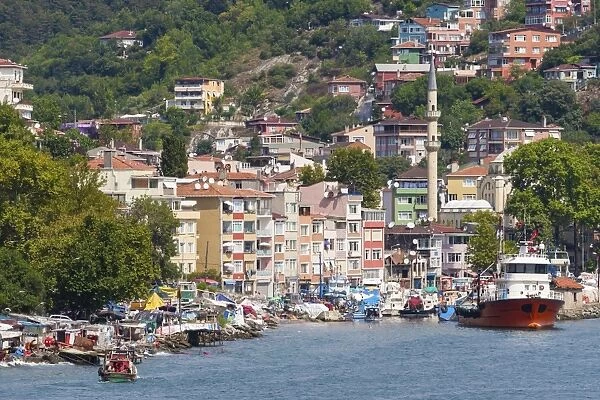 Fishermen and fishing boats, minaret and apartments, Rumeli Kavagi, Upper Bosphorus Strait (European Side), Istanbul, Turkey, Europe