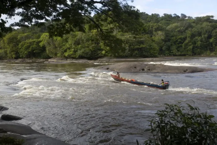 Framed Print : Fishermen going against the rapids on the Approuague River, French Guiana, South America Framed Print : Fishermen going against the rapids on the Approuague River, French Guiana, South America