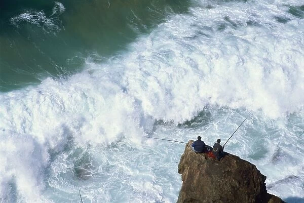 Fishermen on rocks, Tonal Beach, Sagres, Algarve, Portugal, Europe