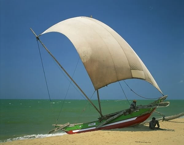 Fishermen in the shade of a sail on a fishing boat