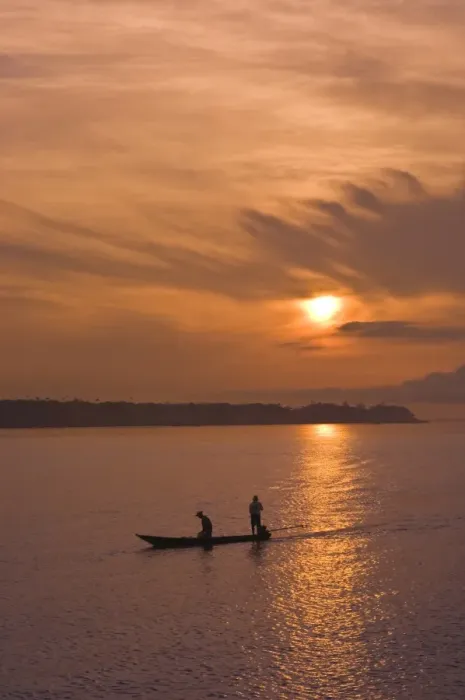 Framed Print : Fishermen at sunset on the Amazon River, Brazil, South America