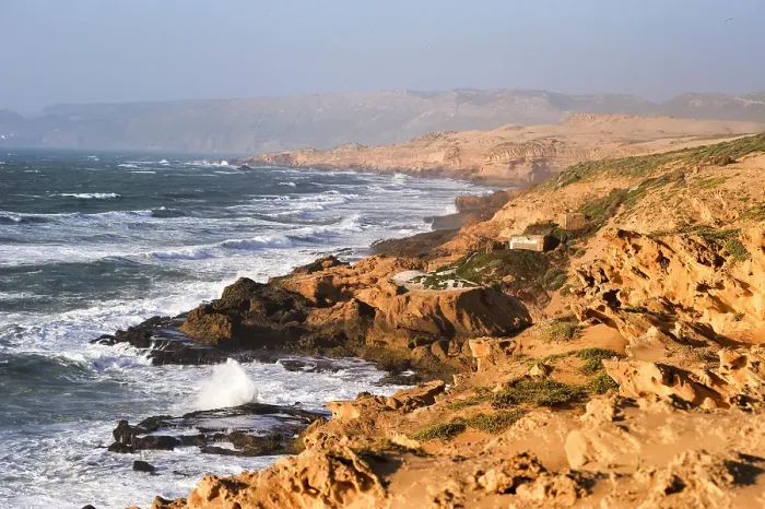 Framed Print : Fishermen's huts perched upon cliffs around Tamri on Atlantic Coast, between Agadir and Essaouira, Morocco Framed Print : Fishermen's huts perched upon cliffs around Tamri on Atlantic Coast, between Agadir and Essaouira, Morocco