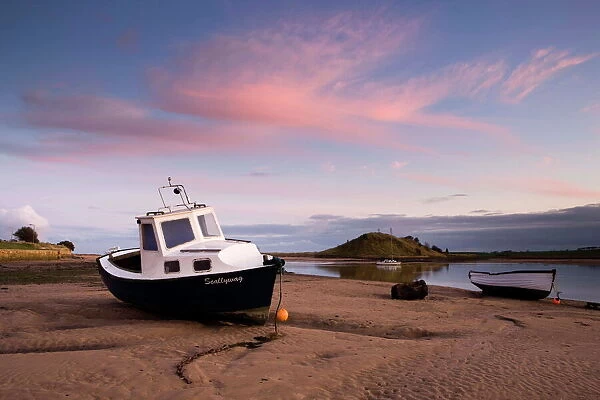 Fishing boat on the Aln Estuary at twilight, low tide, Alnmouth, near Alnwick