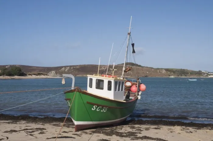 Framed Print : Fishing boat on Bryer with Tresco in background, Isles of Scilly, United Kingdom, Europe