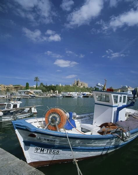 Fishing boat and the cathedral of Palma in the background, on Majorca, Balearic Islands