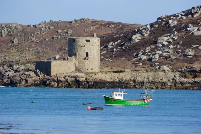 Framed Print : Fishing boat, Cromwells Castle on Tresco, Isles of Scilly, England, United Kingdom Framed Print : Fishing boat, Cromwells Castle on Tresco, Isles of Scilly, England, United Kingdom