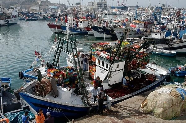 Fishing boat preparing to set sail from Tangier fishing harbour, Tangier, Morocco, North Africa, Africa