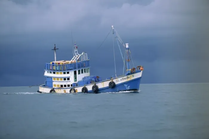 Framed Print : Fishing boat at sea under stormy skies off the coast near Krabi Framed Print : Fishing boat at sea under stormy skies off the coast near Krabi