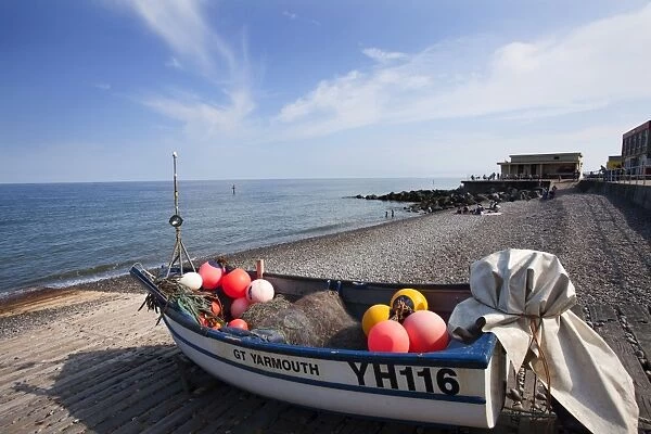Fishing boat on the shingle beach at Sheringham, Norfolk, England, United Kingdom, Europe