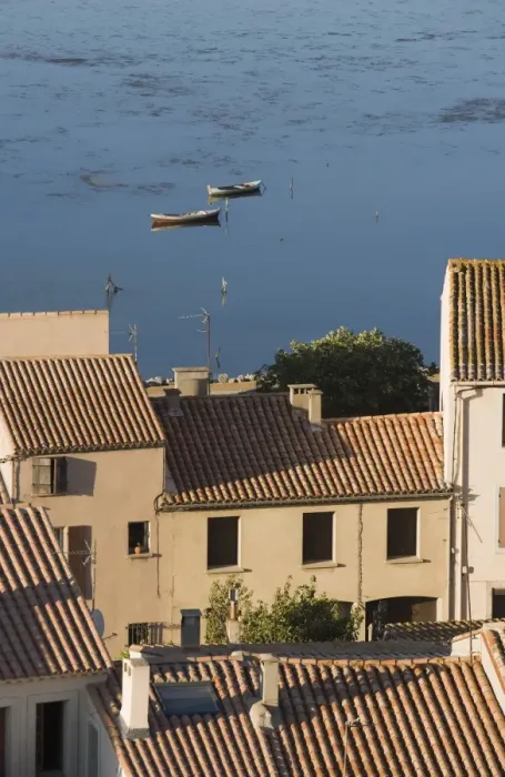 Framed Print : Fishing boats, Etang de L Ayrolle, view of rooftops from Barbarossa tower Framed Print : Fishing boats, Etang de L Ayrolle, view of rooftops from Barbarossa tower
