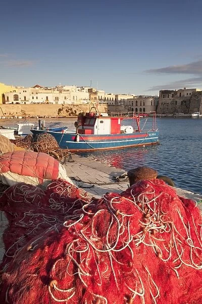 Fishing boats and fishing net at the port, old town, Gallipoli, Lecce province, Salentine Peninsula
