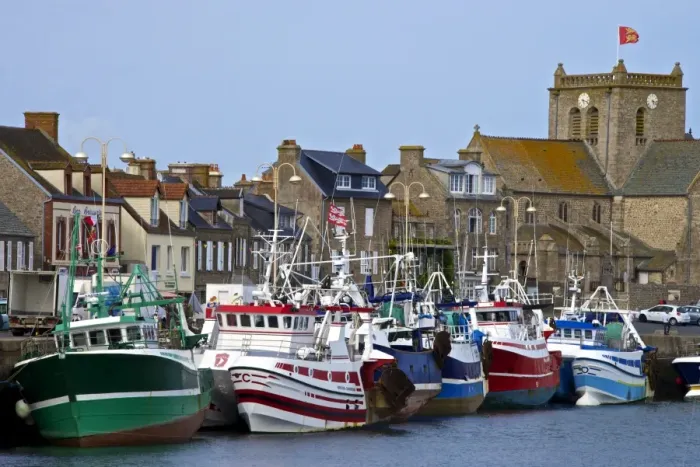 Framed Print : Fishing boats and harbour, and 17th century church in the background, Barfleur, one Framed Print : Fishing boats and harbour, and 17th century church in the background, Barfleur, one