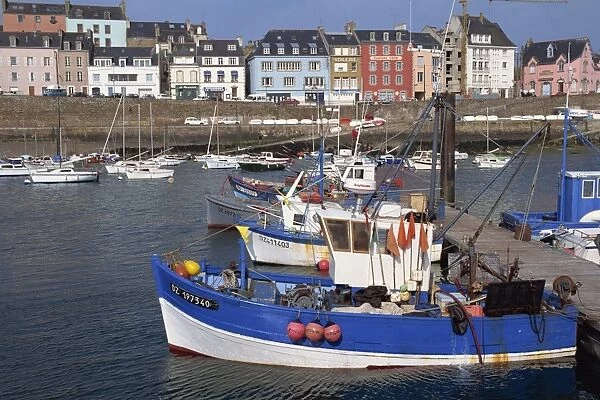 Fishing boats in harbour and houses on waterfront beyond, Rosmeur, Douarnenez
