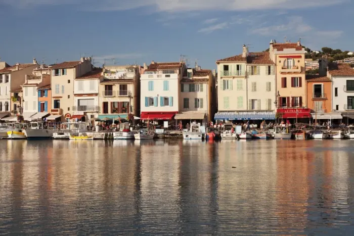 Framed Print : Fishing boats at the harbour, restaurants and street cafes on the promenade, Cassis Framed Print : Fishing boats at the harbour, restaurants and street cafes on the promenade, Cassis