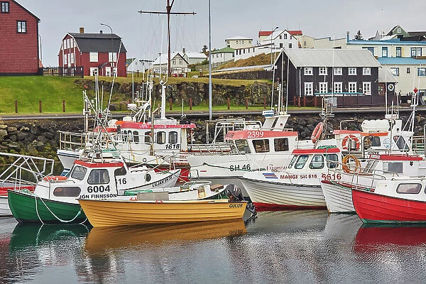 Fishing boats in the harbour at Stykkisholmur, with historic traditional buildings, Snaefellsnes peninsula, west coast of Iceland, Polar Regions