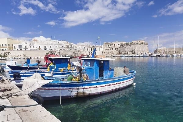 Fishing boats at the port, old town with castle, Gallipoli, Lecce province, Salentine Peninsula