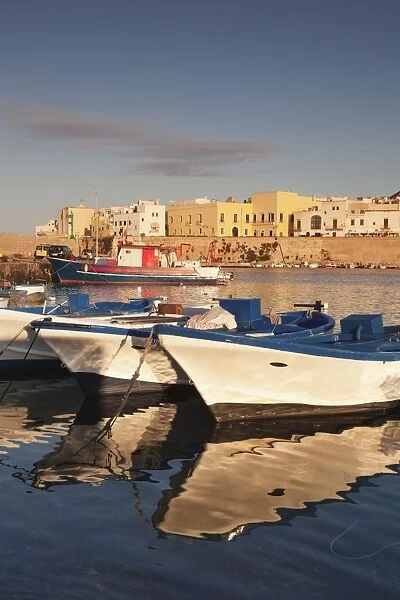 Fishing boats at the port, old town at sunrise, Gallipoli, Lecce province, Salentine Peninsula