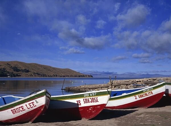Three fishing boats pulled onto shore of Lake Titicaca, Copacabana, Bolivia