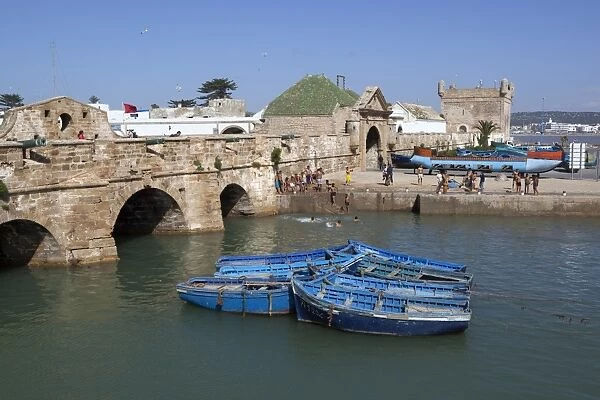 Fishing boats below the ramparts of the old fort, Essaouira, Atlantic coast, Morocco, North Africa, Africa