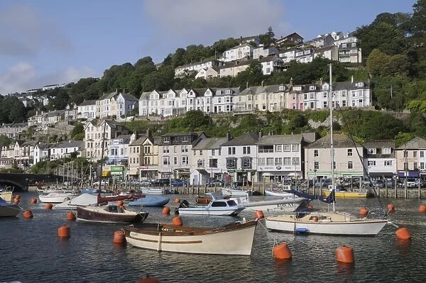 Fishing boats and sailing yachts moored in Looe harbour, Cornwall, England, United Kingdom, Europe