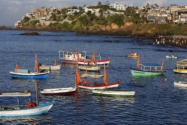 Fishing boats at sea during Lemanja festival on Rio Vermelho beach, Salvador, Bahia, Brazil, South America
