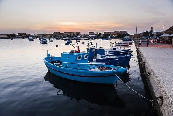 Fishing boats at sunset in Marzamemi fishing harbour, South East Sicily, Italy, Mediterranean, Europe