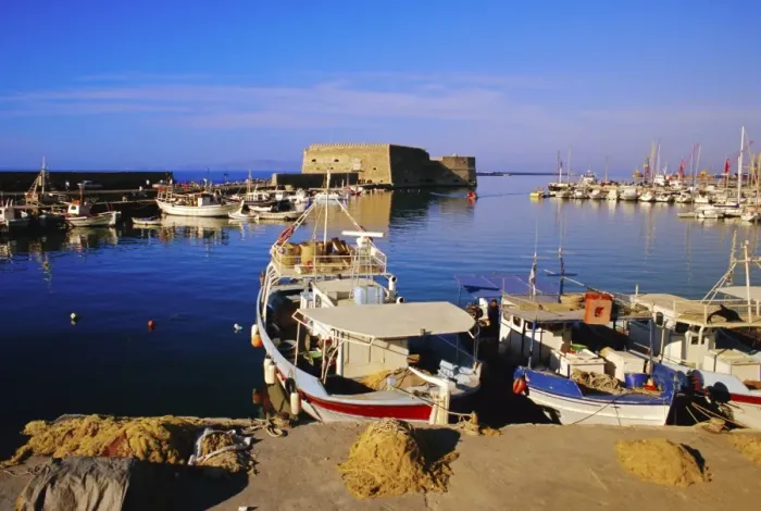 Framed Print : Fishing boats and Venetian fortress at Iraklion old harbour Framed Print : Fishing boats and Venetian fortress at Iraklion old harbour
