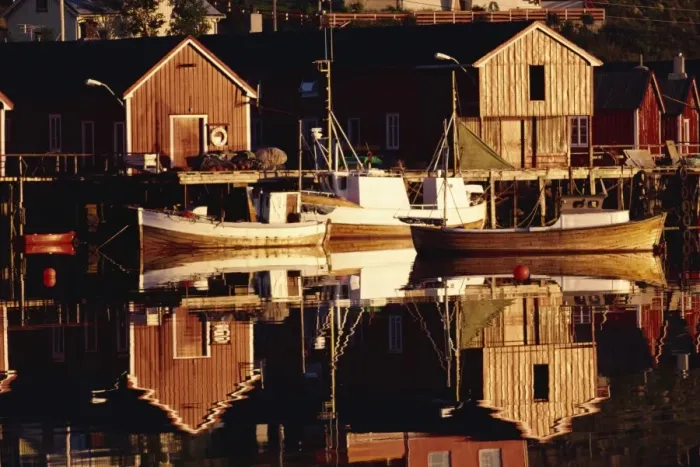 Framed Print : Fishing boats and wooden barns on the waterfront at Bausrad Framed Print : Fishing boats and wooden barns on the waterfront at Bausrad