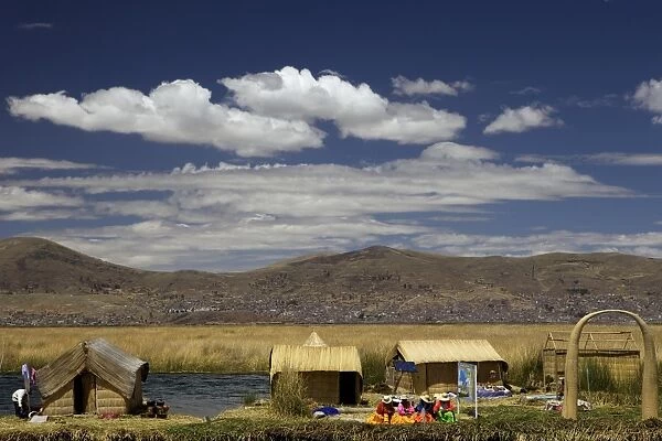 Floating islands of the Uros people, traditional reed boats and reed houses, Lake Titicaca, peru, peruvian, south america, south american, latin america, latin american South America