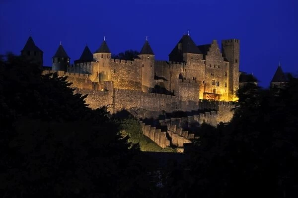 Floodlit view of the walled and turreted fortress of La Cite, Carcassonne