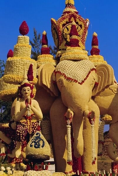 Floral float decorated with elephants and umbrellas