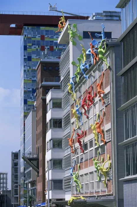 Framed Print : Flossies figures covering a building facade at the Medienhafen Framed Print : Flossies figures covering a building facade at the Medienhafen