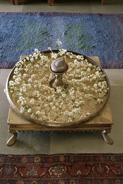 Flower arrangement in traditional brass thali