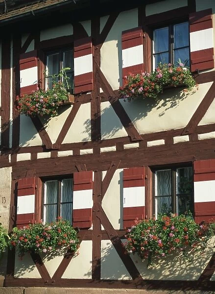 Flower baskets on half-timbered wall