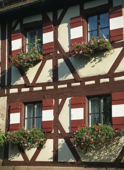 Framed Print : Flower baskets on half-timbered wall Framed Print : Flower baskets on half-timbered wall