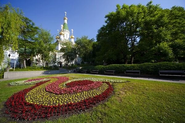 Flower bed in gardens with Church of St. Nicholas the Miracle Maker (The Russian Church)