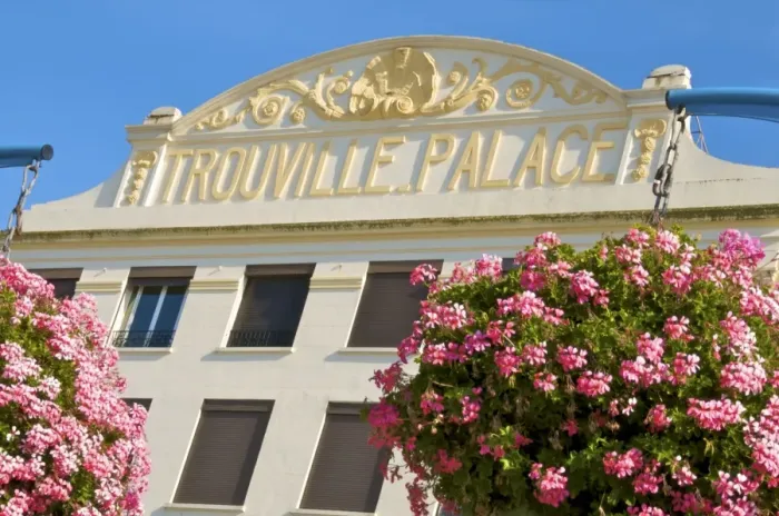 Framed Print : Flowers and facade of the Trouville Palace Hotel, now turned into apartments Framed Print : Flowers and facade of the Trouville Palace Hotel, now turned into apartments