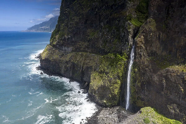 Flowing water of Bridal Veil Fall cascading from rocks, Seixal, Madeira island, Portugal